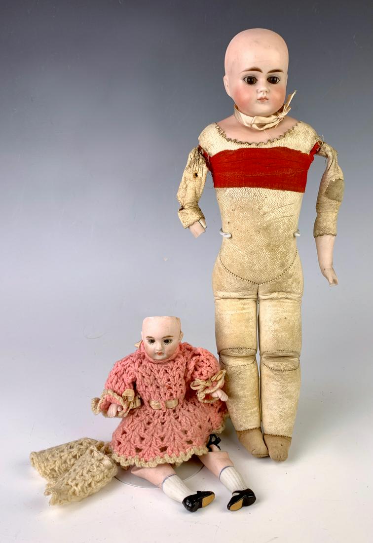 Lot of Two Dolls: 5.5" German All Bisque Child by Kestner, C. 1895, blue glass sleep eyes, no wig, closed mouth, body jointed at shoulers and hipsstiff neck, marked "150" on back of head, unstrung, old chrocheted outfi