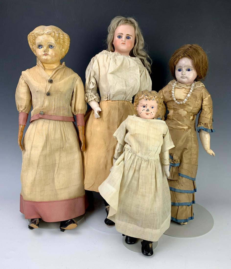 Lot of Four Antique Dolls: Three German dolls, circa 1880, one possibly Minerva, poor condition, with a German papier mache doll with antiques clothing in fair condition, with a German wax over composition doll with original si