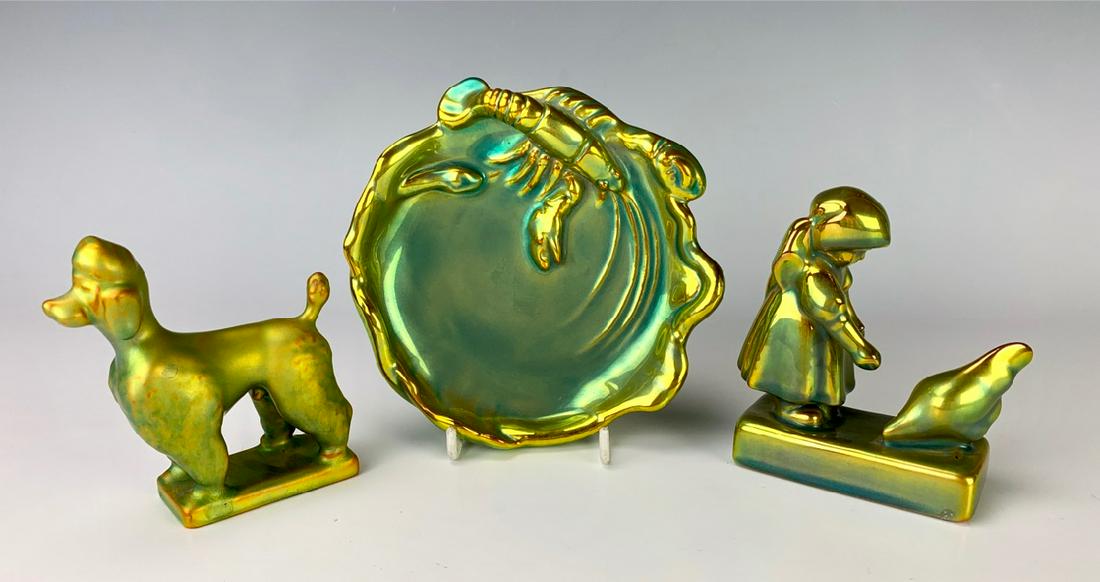 3 Zsolnay Iridescent Figurals: Consisting of a poodle dog, girl feedig a chicken and a lobster dish, all in a green gold iridescence, all 3 are signed, very good condition, 6" diameter of dish