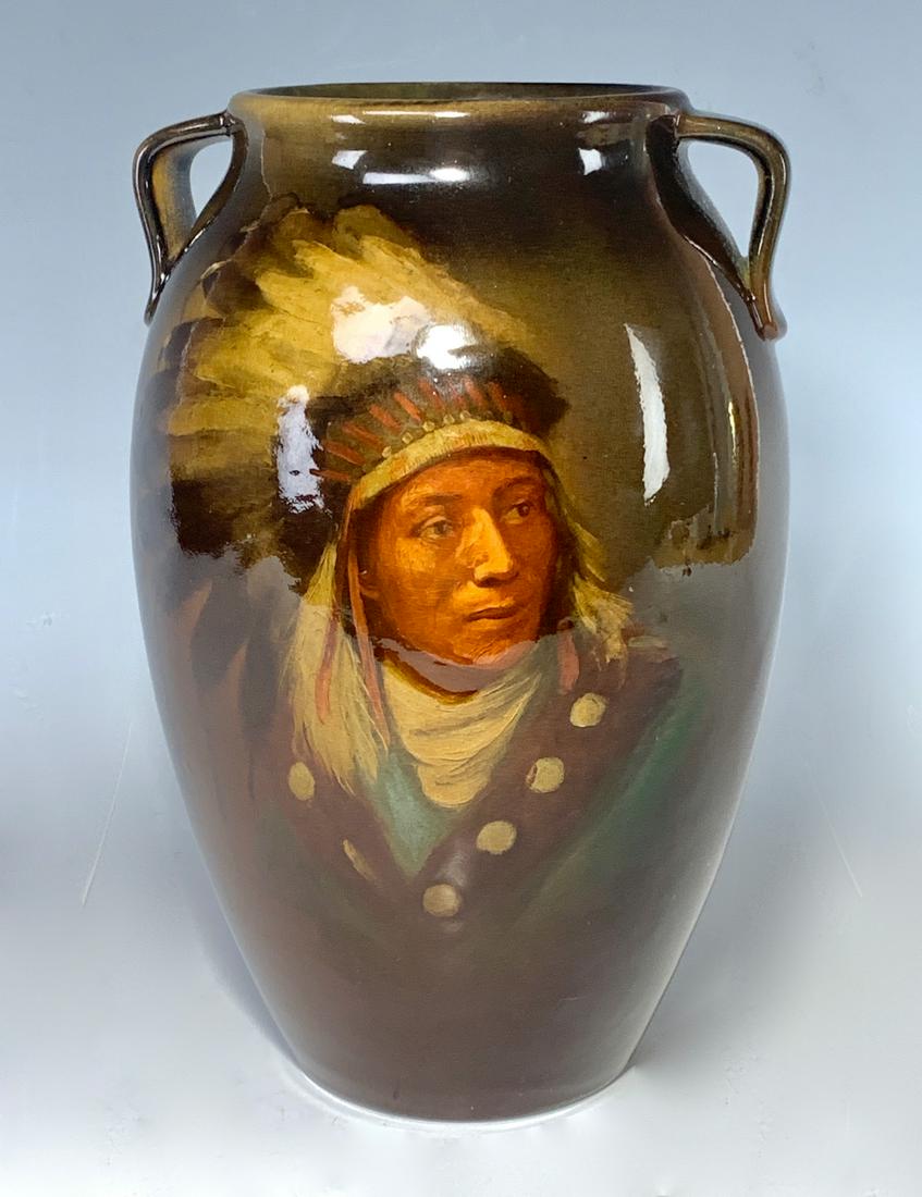 Rookwood Pottery Native American Portait Vase: Having a double handle and a hand painted portrait of a Native American chief "High Hawk Jr. Sioux", signed "Rookwood S1667B SL (Sidney Lawrence)", good condition, 9" height