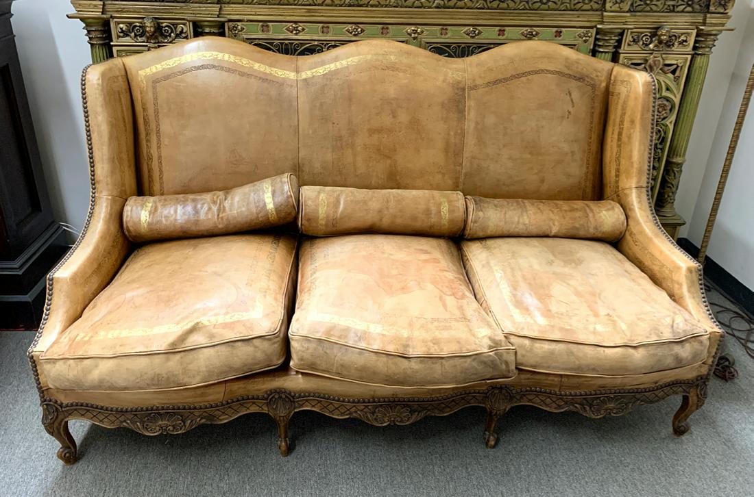 Vintage High Back Leather Couch: Offering this high back 3 section leather couch with fancy gold trim, comes with 3 cylindrical matching leather pillows, good condition, 40" x 72" x 40"