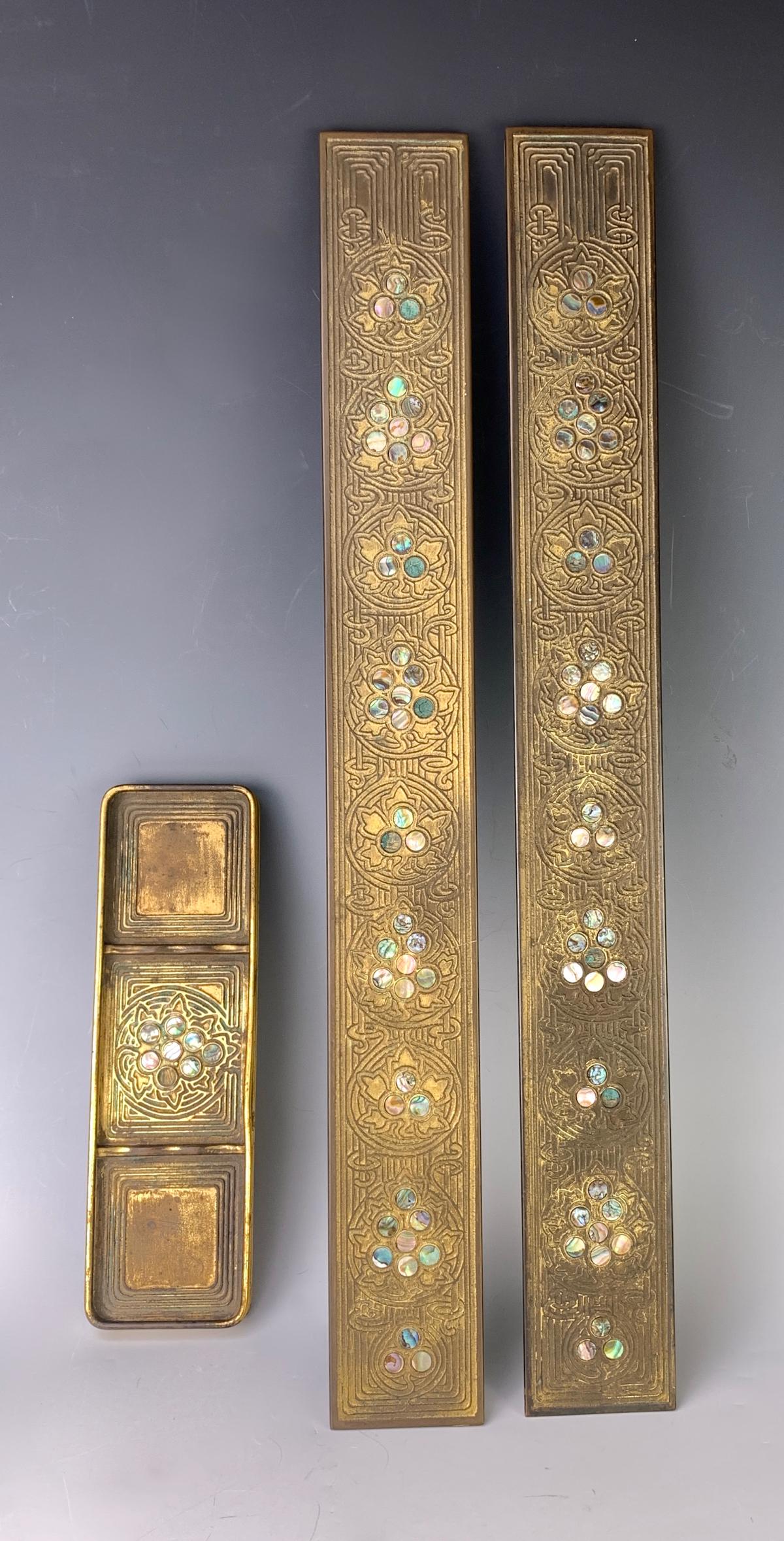 Tiffany Studios Abalone Blotter Ends & Pen Wipe: Pair of Tiffany Studios abalone blotter end and pent trap, both signed and numbered, "Tiffany Studios, New York" "1152" and "1199", both missing some abalone, rub wear commensurate with age, 19" longe