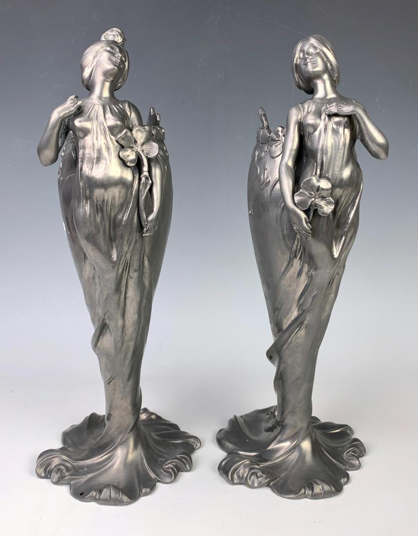 Claude Bonnefond Pair Art Nouveau Vases: Circa 1900, wonderful pair of original pewter art nouveau vases, both having raised relief lady figures holding 4 leaf clovers, both signed "C. Bonnefond", pictured in Phillipe Dahhan's book "Etains 1