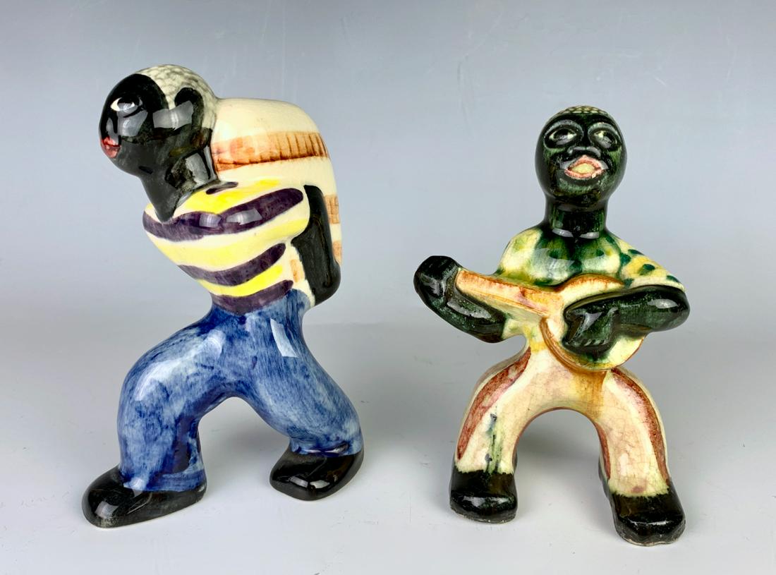 Pair Shearwater Black Americana Figurines: 2 Shearwater Pottery black Americana figurines, one playing banjo, the other with bale of cotton, one is marked, good condition, 4.5" x 3"
