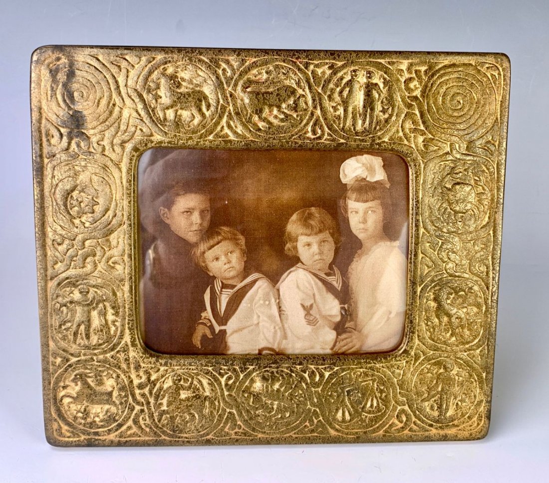 Tiffany Studios "Zodiac" Gilt Bronze Frame: Signed "Tiffany Studios, New York, 943", slight wear to patina commensurate with age, 7" x 8"