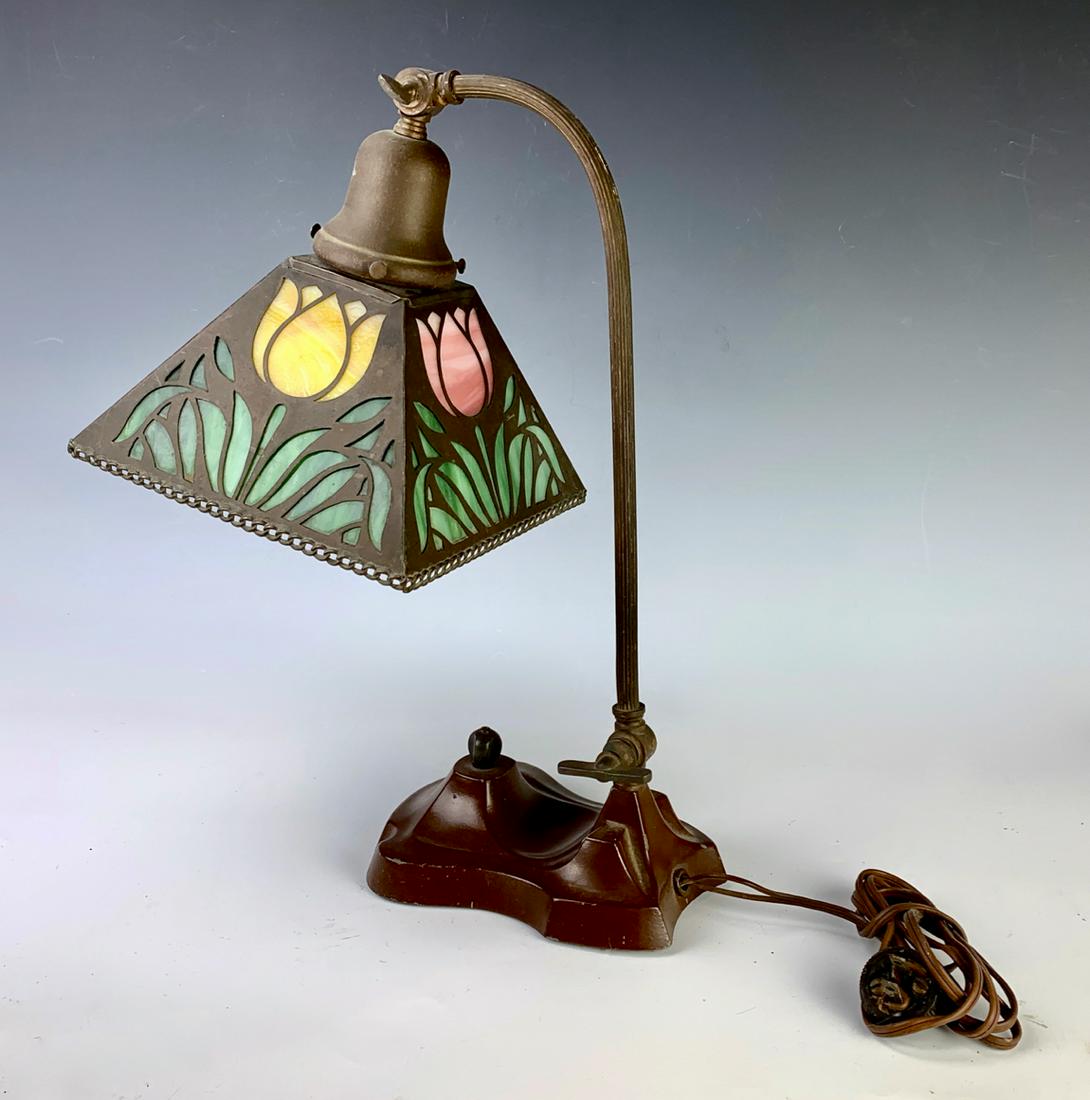 Arts & Crafts Tulip Desk Lamp Circa 1940: Having square form, arts and crafts shade with each side having leaded stained glass panels with tulips, mounted on an adustable double knuckle base, good condition, 15" height, 7" square shade *Wirin