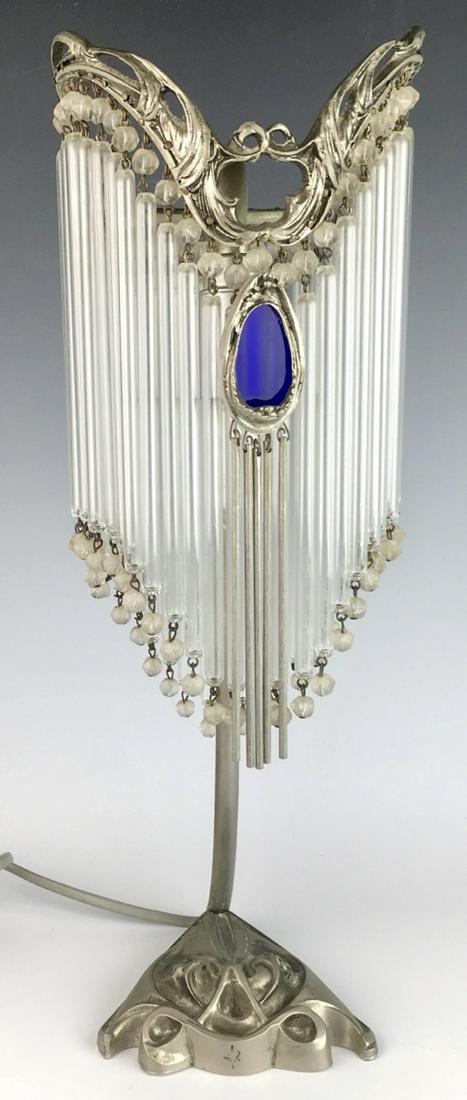 Art Nouveau Table Lamp "Hector Guimard" Style: Circa 1960, has mark for Sofar France, nickel plated metal desk lamp in the style of Hector Guimard (1867-1942) having a tubular upright cache ampoule composed of rows of tubes and translucent glass b