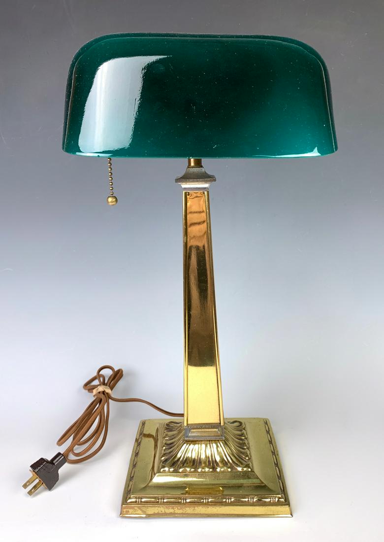 Signed Emeralite Green Cased Glass Shade Lamp: Mounted on a polished brass base, has adjustable knuckle, very good condition, 17.5" height, 8.5" shade width *Wiring should be inspected before use*