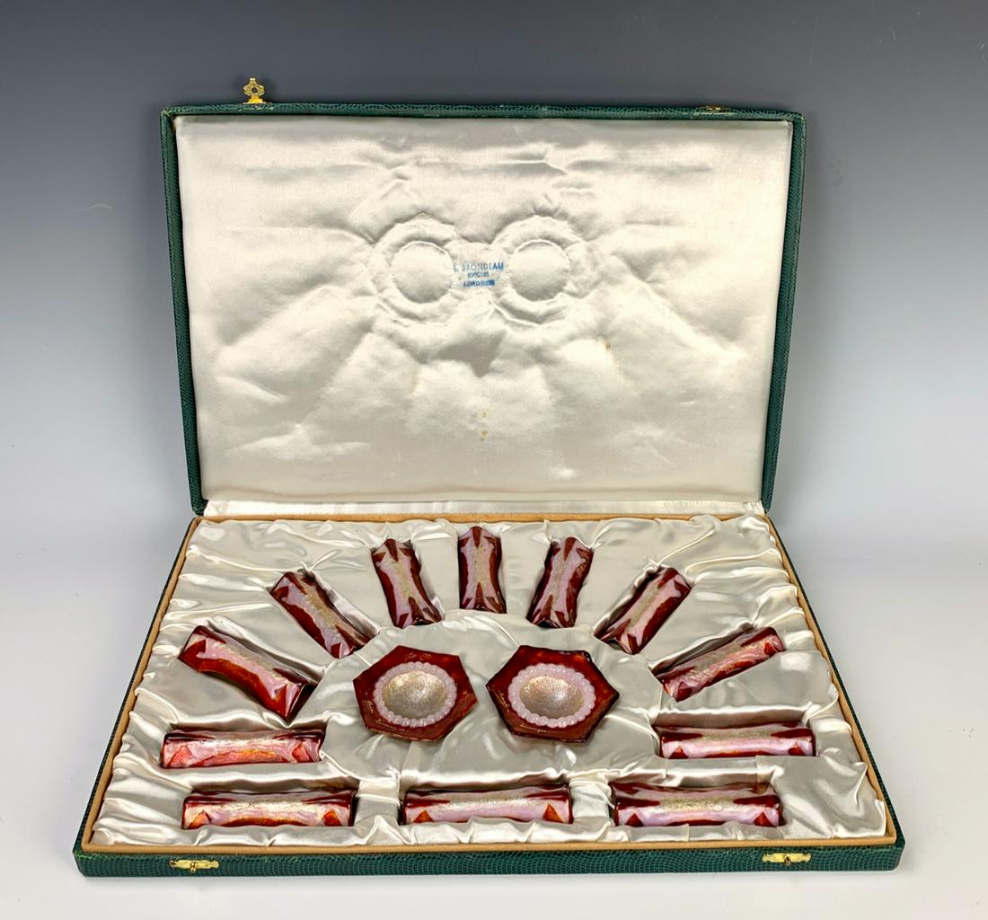 Limoges Enamel Knife Rests & Salts Set: Limoges enamel table set, designed by Marylou Fauvet in original display box, comprising 12 knife rests and 2 salts in pink and red enamels on copper, each marked "Marylou" and "Limoges", very good co