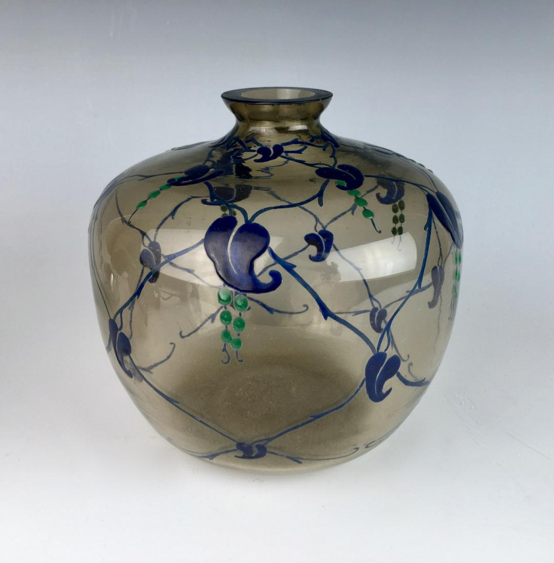 M. Goupy Art Deco Enameled Vase C.1920: Having blue enamel leaves connected by vines over a smoke clear glass body, signed on bottom "M. Goupy", good condition, 6.5" x 7"