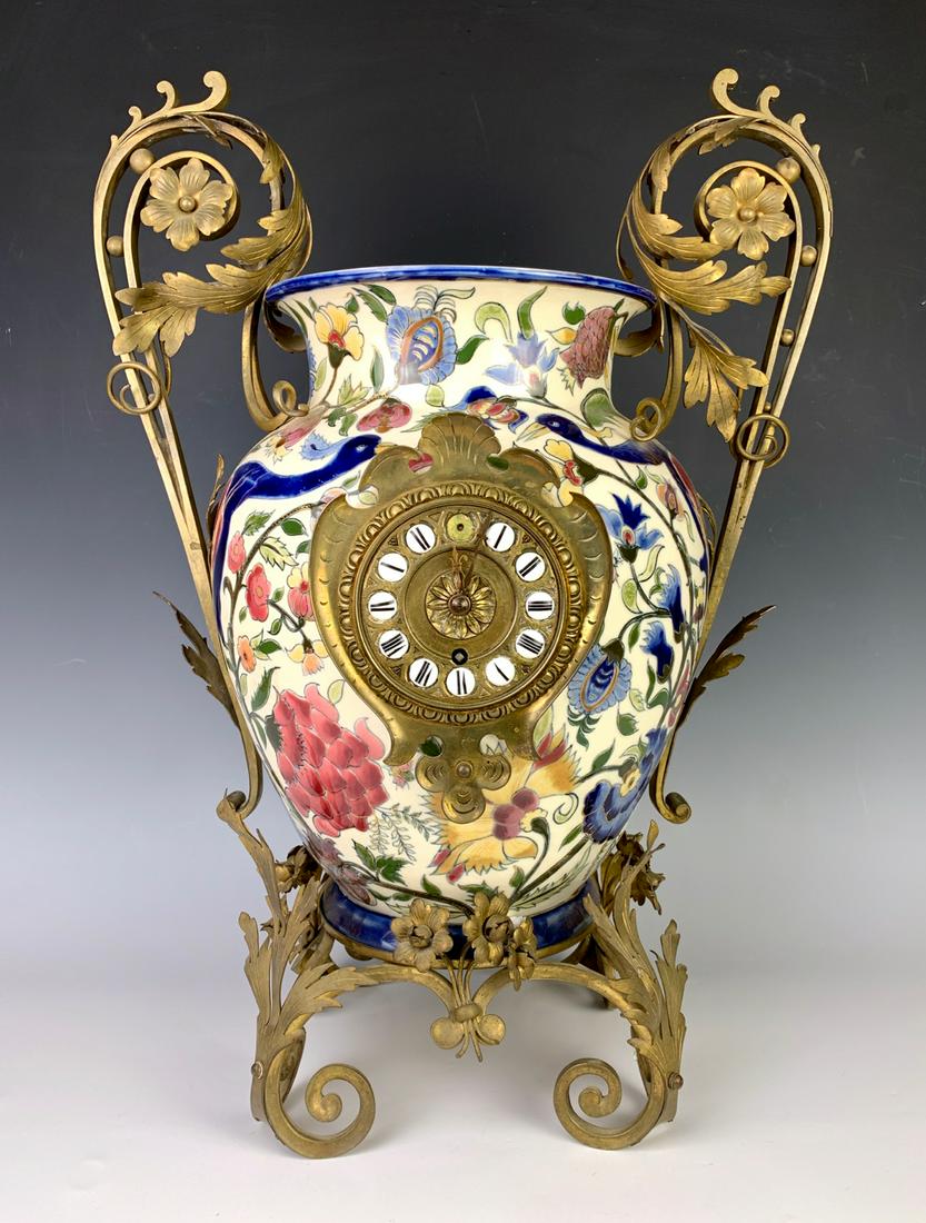 Large Zsolnay Ceramic & Bronze Clock: Hand painted urn clock decorated with flowers, flamingos framed in bronze scrolls flowers and leaves, signed on bottom "Zsolnay" with blue churches, comes with photos and other paperwork, good conditi