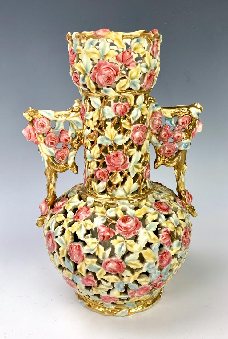 Zsolnay Rose Vase: Pierced and carved porcelain vase, decorated throughout with roses and leaves, very good condition, 11" height