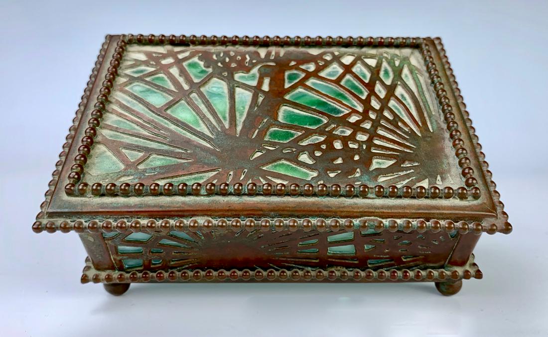 Tiffany Studios Pine Needle Box: Having green stained glass with dark bown patina, unmarked, one cracked panel on back side, 1.75" x 4.5" x 3"