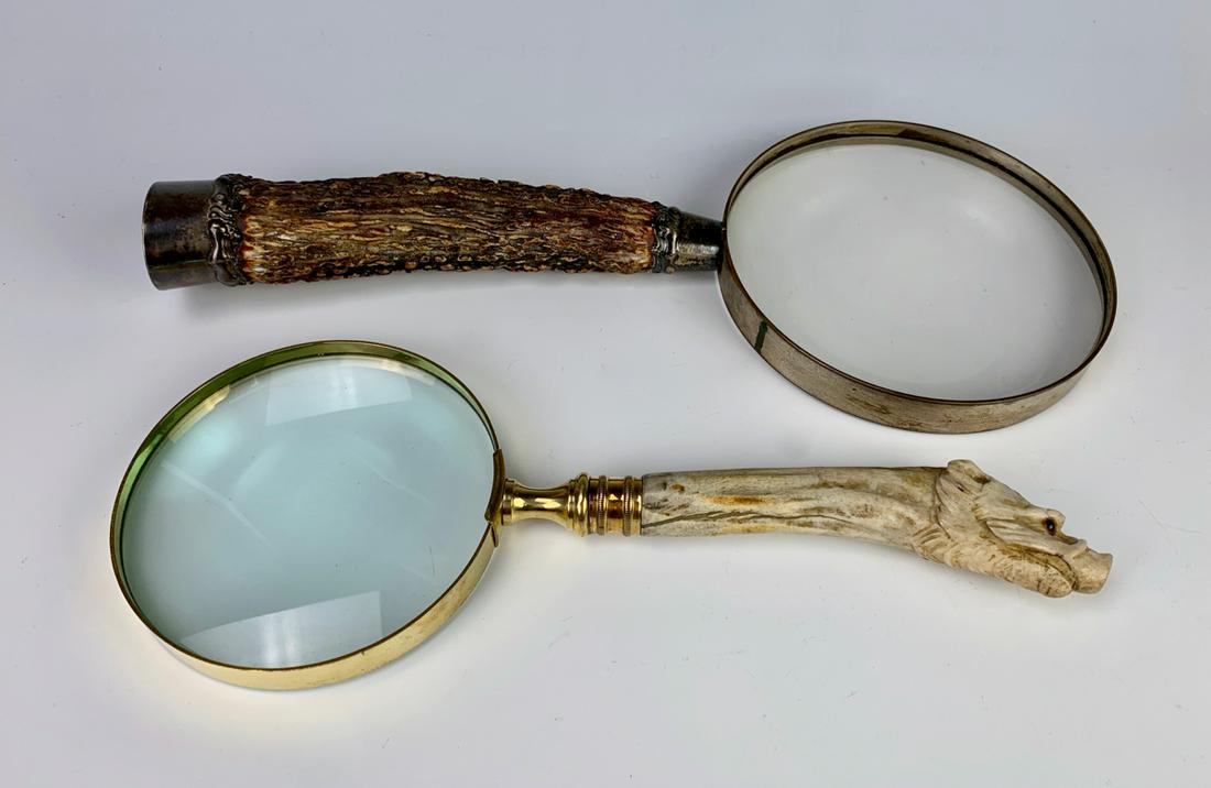 Pair Antique Boar's Head & Horn Magnifying Glasses: Carved from bone is this boar's head magnifying glass with glass eyes and a horn and sterling silver handled magnifying glass, very good condition, 12" longest