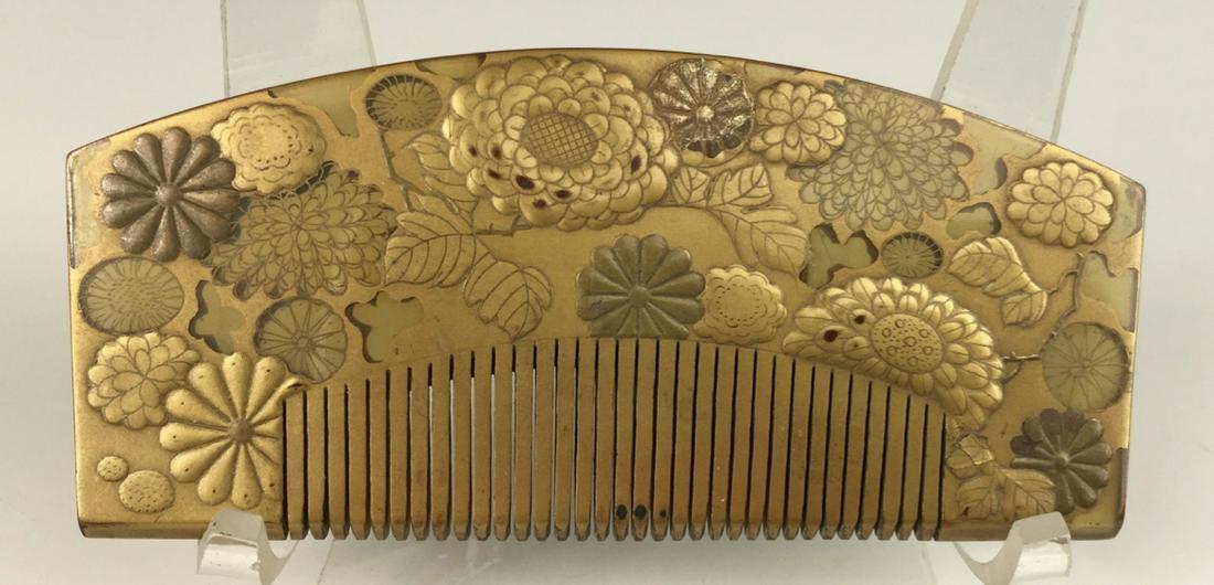 Japanese Gilt Decorated Comb: Circa 1930's, having raised relief in gilt flowers and leaves, made of bakelite, very good condition, 4.5"