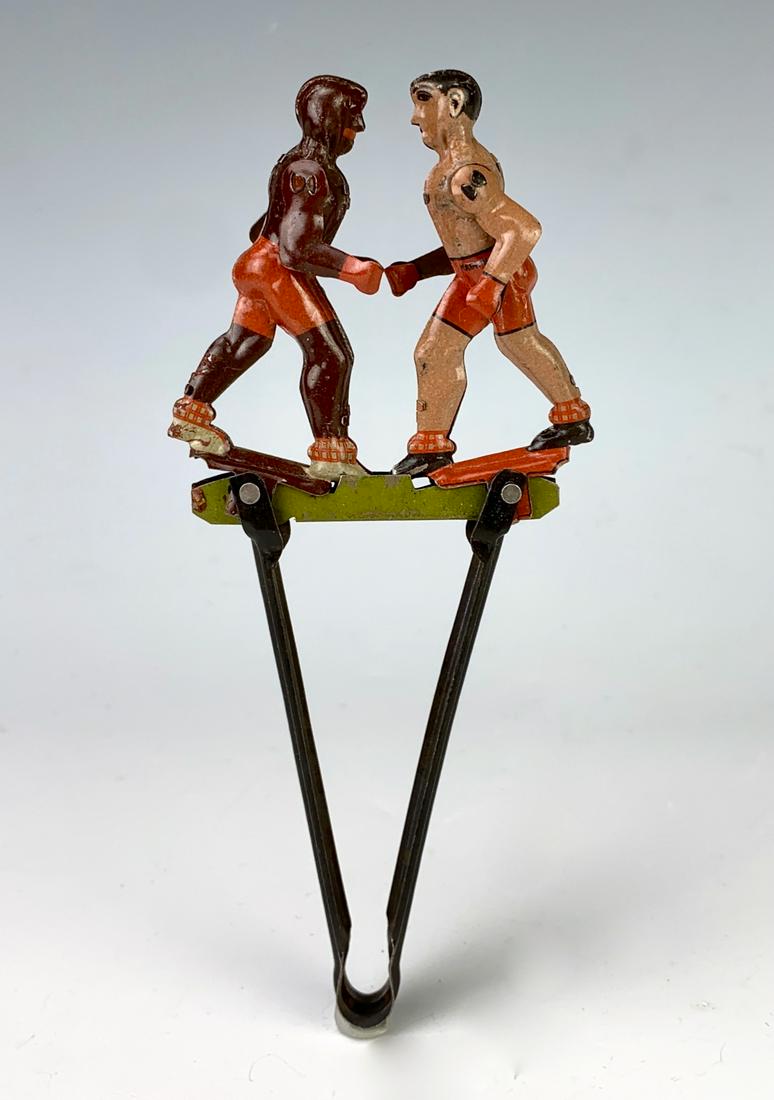 Rare Antique German Tin Penny Squeeze Toy "Boxers": Marked "Made in Germany", early tin embossed lithographed penny squeeze toy of 2 boxers, very good condition, 5.75" length **Lifetime estate collection of Jeannine Hamilton, Oak Park, CA** *Domestic i