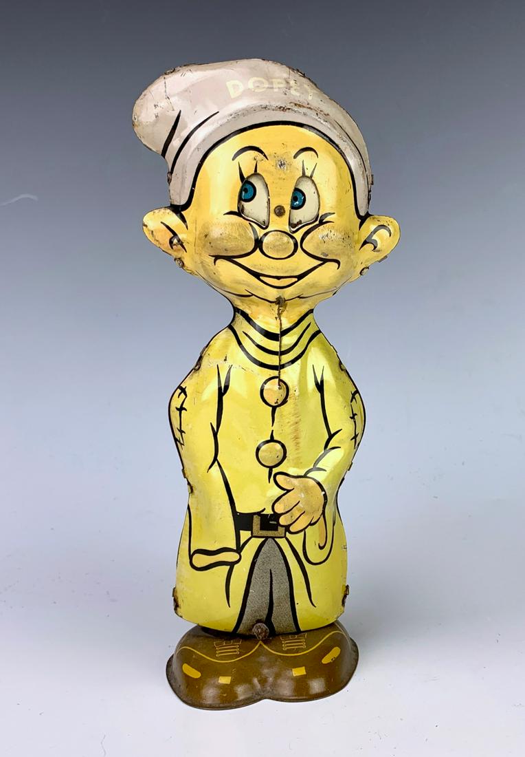 Marx Dopey Tin Lithographed Wind Up Toy: Humorous tin toy when wound up it whacks, marked with the Marx logo and "1938 Copyright", good condition, works fine, 8.25" height **Lifetime estate collection of Jeannine Hamilton, Oak Park, CA** *Co