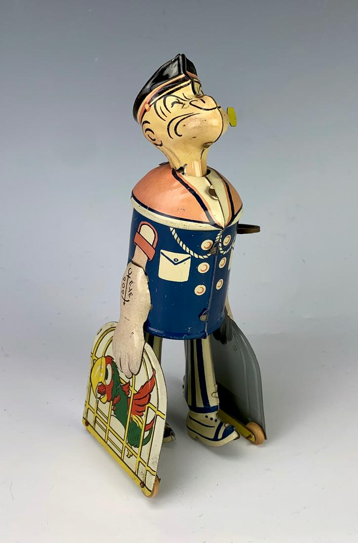 Marx Popeye Parrot Cages Tin Wind Up Toy: Walking Popeye tin wind up toy, very good condition, works fine, 7.5" height **Lifetime estate collection of Jeannine Hamilton, Oak Park, CA** *Contact us to see this lot in action* *Mechanics are not