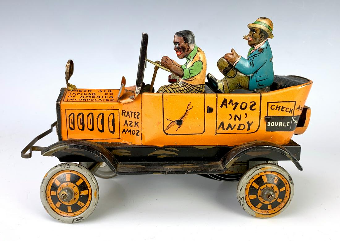 Marx Toys Amos & Andy Fresh Air Taxi: Spring driven wind up tin toy depicting Amos and Andy figures with a dog seated in a convertible automobile, very good condition, 5" x 8" **Lifetime estate collection of Jeannine Hamilton, Oak Park, C