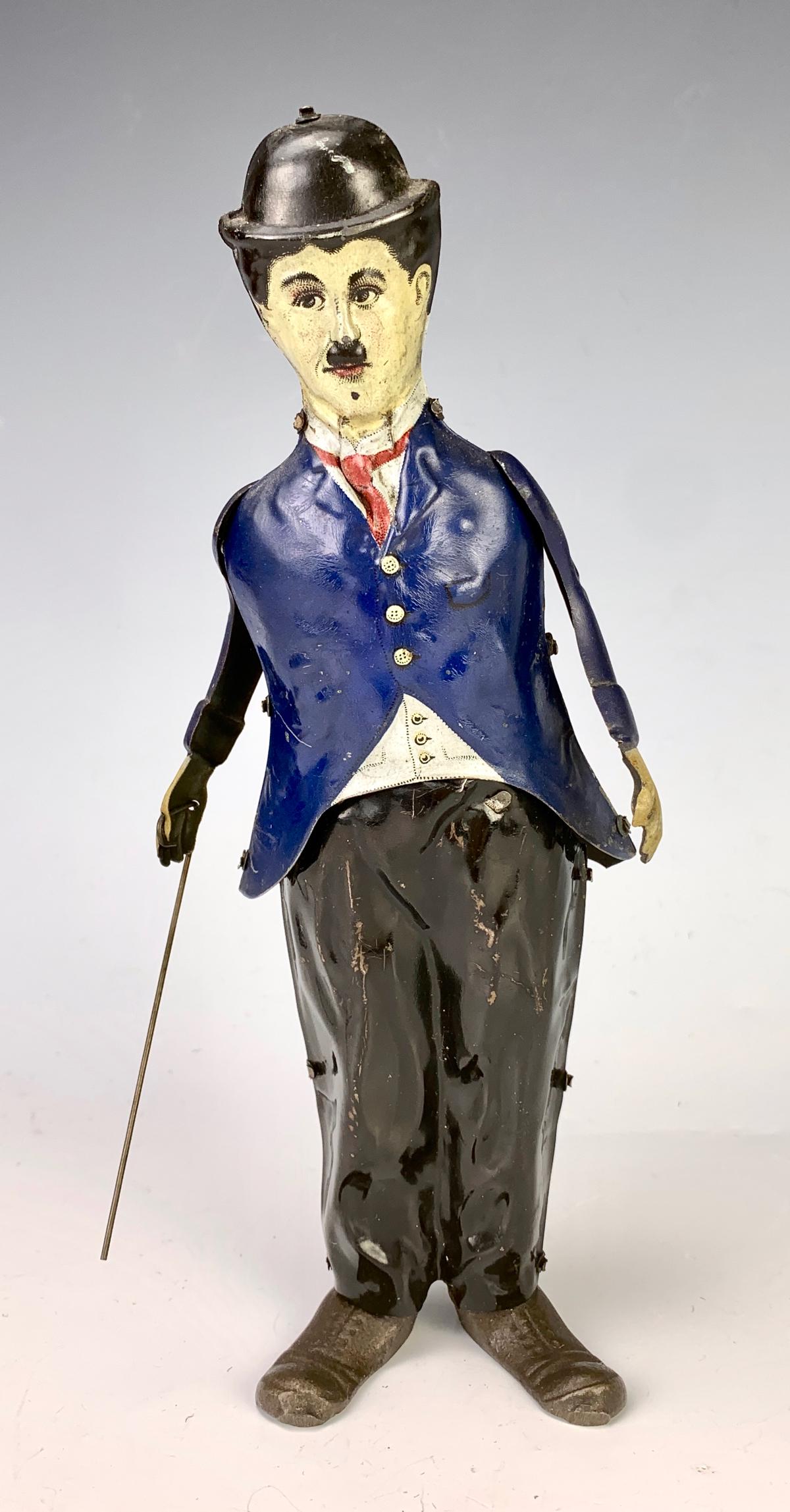 Rare Charlie Chaplin Tin Walking Wind Up: Circa 1920, a rare full bodied tin wind up with cast iron feet, made by B&R Toy Company, NJ, which later became Unique Art Toy Company, very good condition, works fine, 8.5" height **Lifetime estate c