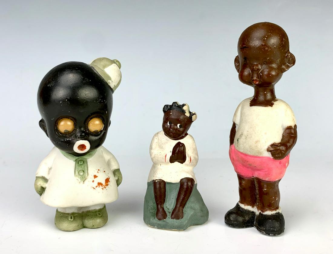 Group of 3 Bisque Porcelain Black Figures: Consisting of googly moveable glass eyes marked "Snowflake" by Oscar Hitt, Germany, Henry comics character marked "Henry Copyrighted Hal Anderson" and a sitting girl praying, good condition, 3.5" tall