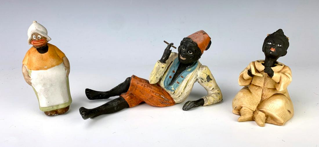 Group of 3 Black Americana Nodders C. 1900: Consisting of a reclining man smoking a cigarette, bisque nodder with book and humorous comic figure, good condition, 3.25" height **Lifetime estate collection of Jeannine Hamilton, Oak Park, CA** *Do