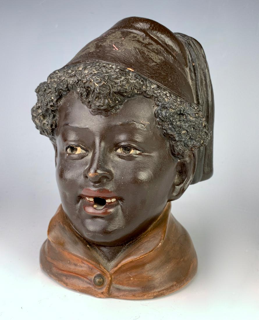 Bernard Bloch Black Man w/ Felt Hat Bust C. 1900: Made of terra cotta, has hole in it's mouth as well as a hole in back, not sure what it was used for, very good condition, 6" height **Lifetime estate collection of Jeannine Hamilton, Oak Park, CA** *