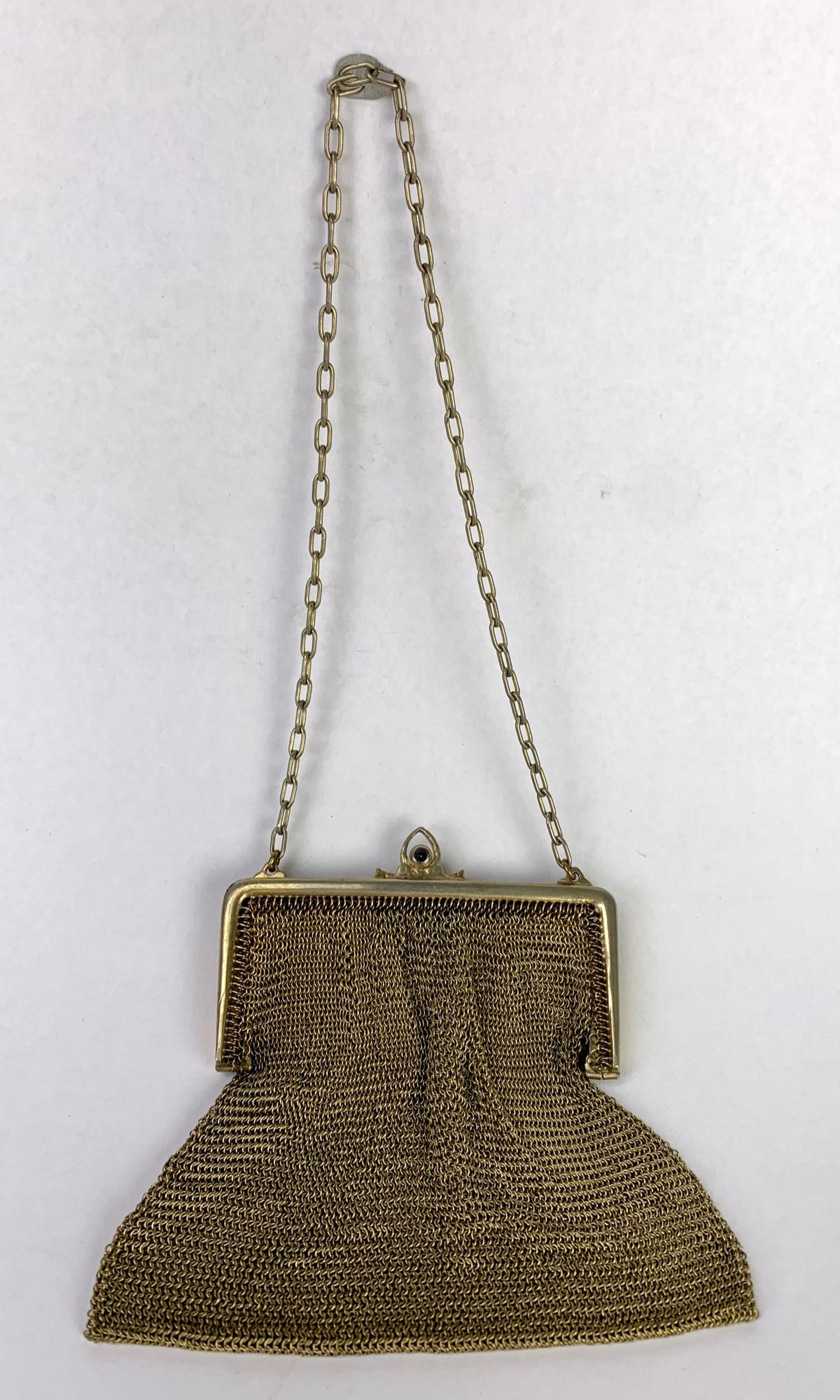 10k Cartier Mesh Ladies Purse: Signed Cartier gold mesh bag, marked 14k but tests 10k, 84 grams, 4" x 3" without chain *Domestic in-house shipping available on this lot*