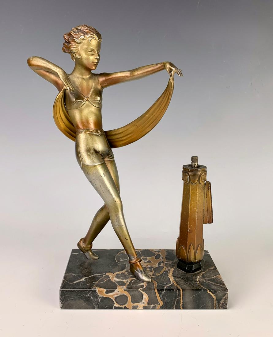 Art Deco Nude Dancer Figurine Cigar Lighter: Circa 1920, art deco polychrome painted finished nude dancer with a scarf, alongside a deco pedestal which stores the wand and strike, mounted on a veined marble plinth, very good condition, 10.75" he