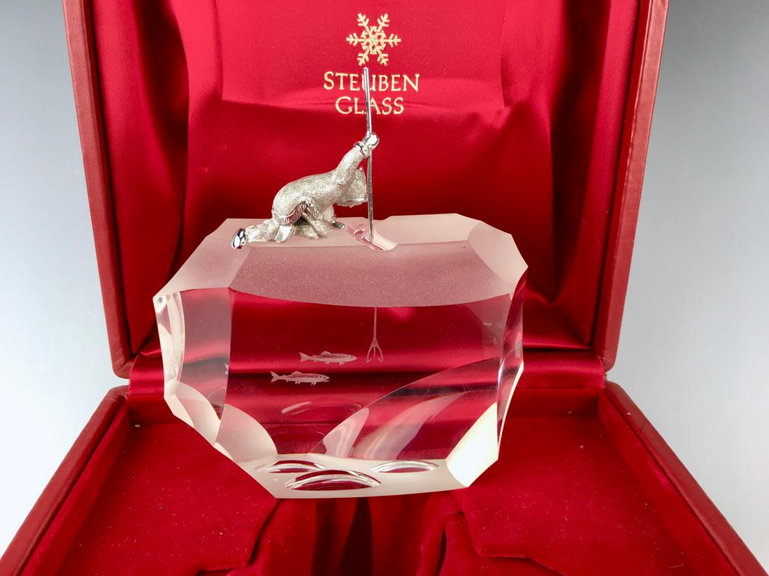 Steuben "Arctic Fisherman" Sculpture: Steuben crystal sculpture titled "Arctic Fisherman", sterling Alaskan eskimo ice fishing on a crystal iceberg with silver metal spear, designed by James Houston with original Steuben red fitted box, 6