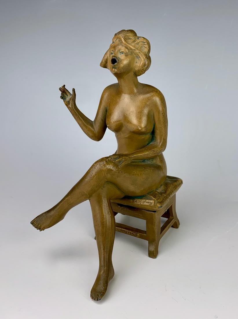 Art Nouveau Sitting Nude Incense Burner C. 1900: Humorous collectible of a naked lady sitting on a stool, incense when burned allows smoke to come out her mouth, painted a light brown color over metal, marked on back "Smoking Venus", very good condi
