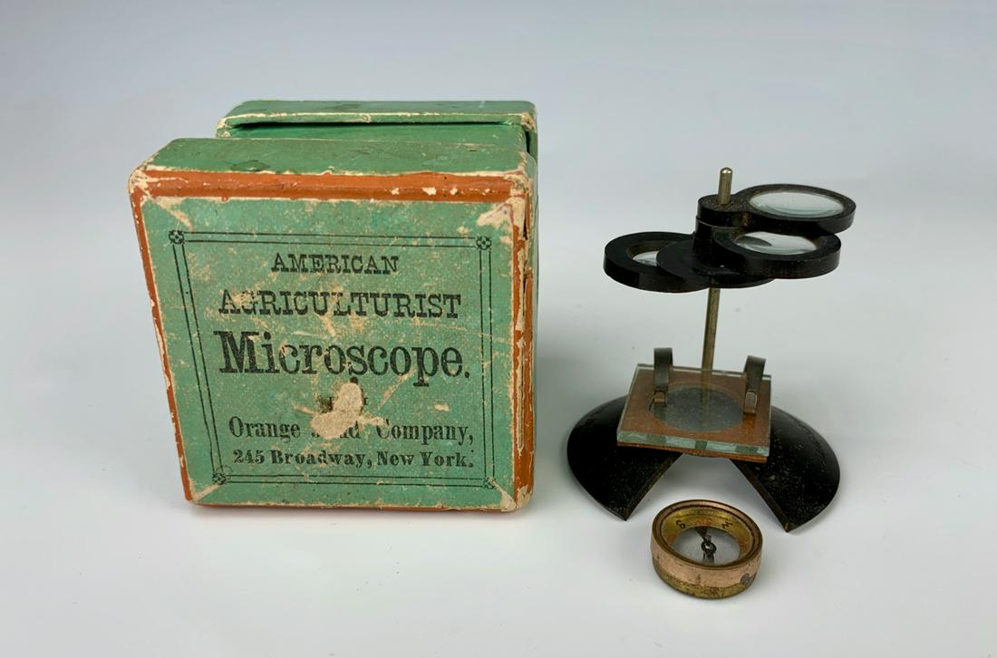 American Agriculturist Microscope C. 1900: With original box, made by Orange Judd Company New York, marked "Bauch & Lomb Optical Co, Rochester, NY", comes with compass, 1.75" height **Lifetime estate collection of Jeannine Hamilton, Oak Park, 