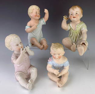 Group of 4 Antique Bisque Piano Babies: Nice lot consisting of 4 German bisque porcelain piano babies, one is marked with Rudolstadt mark, another with unidentified mark and the others not marked, very good condition, 8" tallest **Lifetime