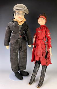Pair Humorous Boudoir Smoking Dolls: Circa 1930's, having a sexy gal with red dress and tall black boots with composition head, having a sword at her waist, the man wearing a striped suit, grey hat, Lenci style head, both with