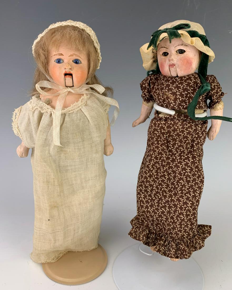 Pair of Squeeze Box Dolls: Both dolls have push button spots on chest, fair condition, one works fine, the other not working, 9.5" height **Lifetime estate collection of Jeannine Hamilton, Oak Park, CA**