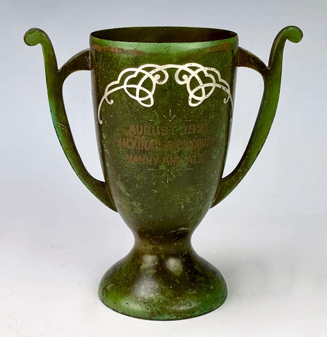Heintz Sterling on Bronze Trophy Vase Green Patina: Circa 1921, Heintz two handled trophy vase showing a desired green mottled patina, logo on bottom, good condition, 5" height 5" diameter*In-house shipping within the U.S. available for this lot*