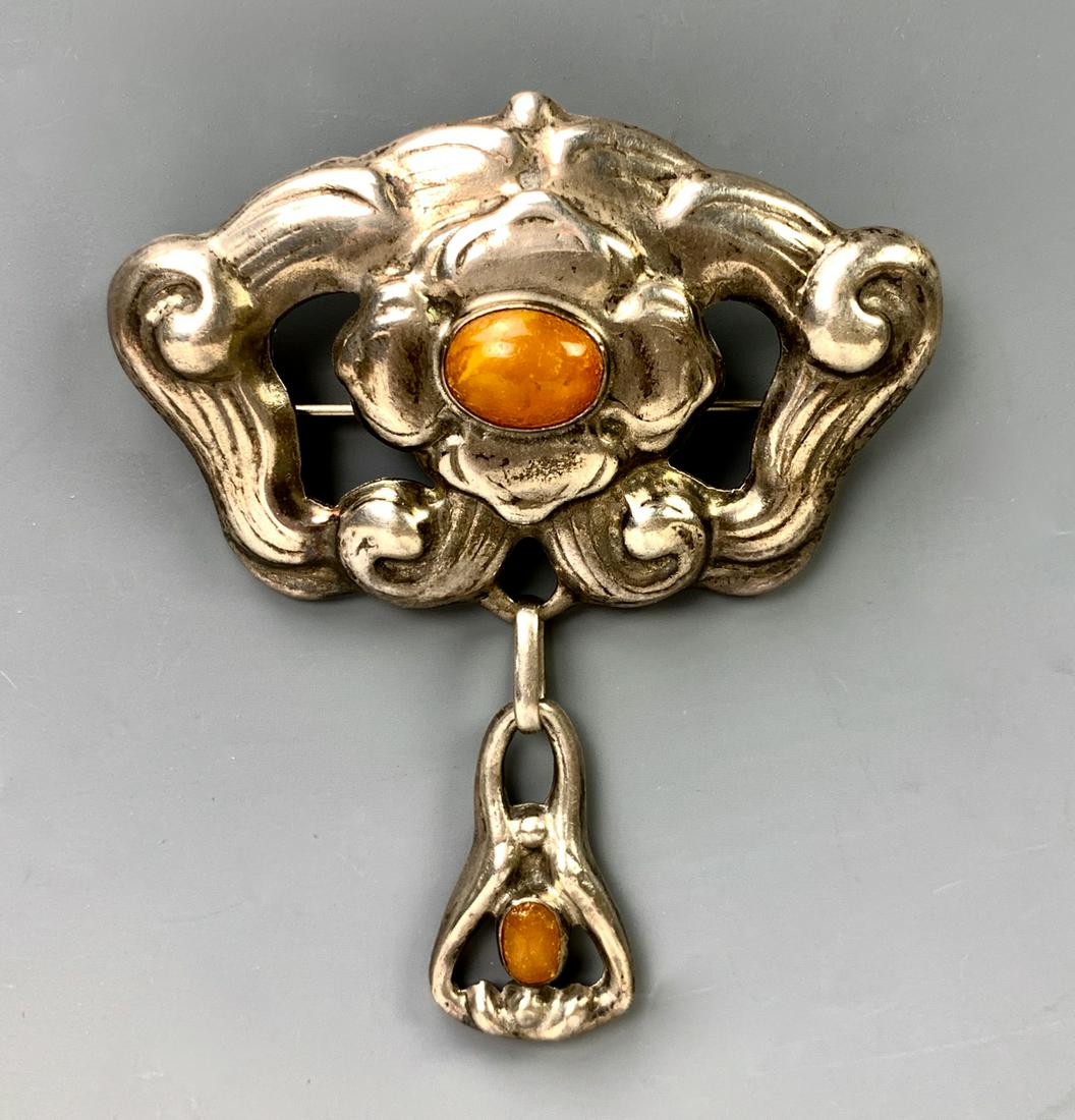Danish Sterling Silver Brooch sgd William Fuglede: Scandinavian art nouveau brooch in silver with carnelian cabochons, marked "Wm F 830" (Copenhagen 1907-1937), very good condition, 2.75" x 2.5"*In-house shipping within the U.S. available for this lot