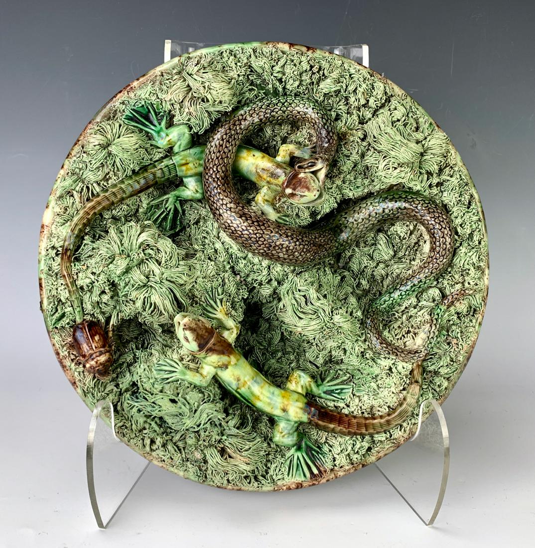 Palissy Ware Platter: Portuguese majolical "Palissy Ware" platter by Calda Portugal, glazed in earth tones and contains snakes, lizards, and a beetle, good condition, 12" diameter