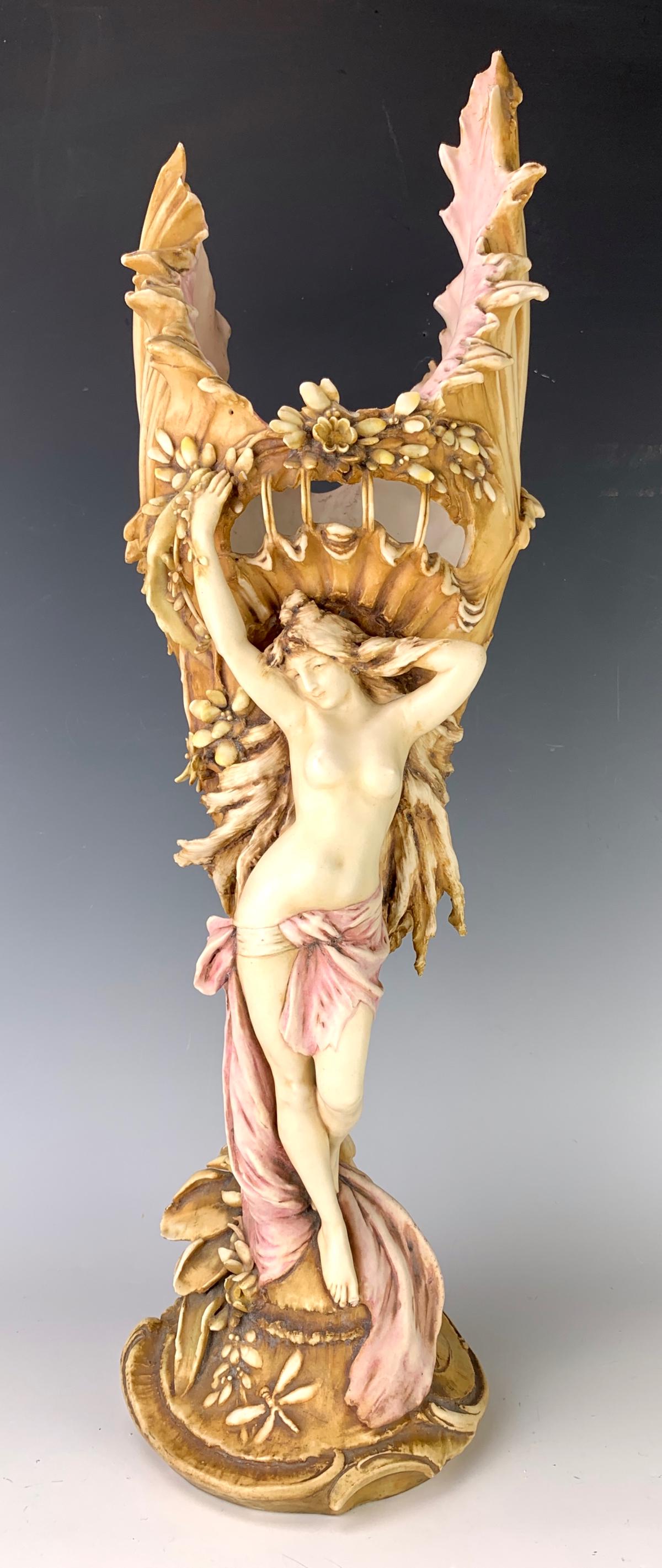 RSTK Teplitz Art Nouveau "Nude Vase": Beautiful Amphora porcelain art nouveau vase depicting a nude standing in front of floral decorated vase, has dragonflies at bottom, marked in red with RSTK factory marks, a few minor chips, 21" heigh
