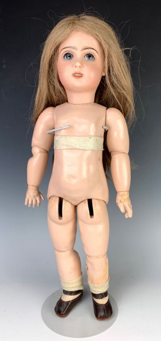 20.5" Tete Jumeau Porcelain Doll, Open Mouth: Having a porcelain bisque head doll signed "Tete Jumeau", open mouth, sleeping eyes, marked with Tete Jumeau red stamp, composition body with stamp "Tete Jumeau", light chipping on one lower eyelid, o