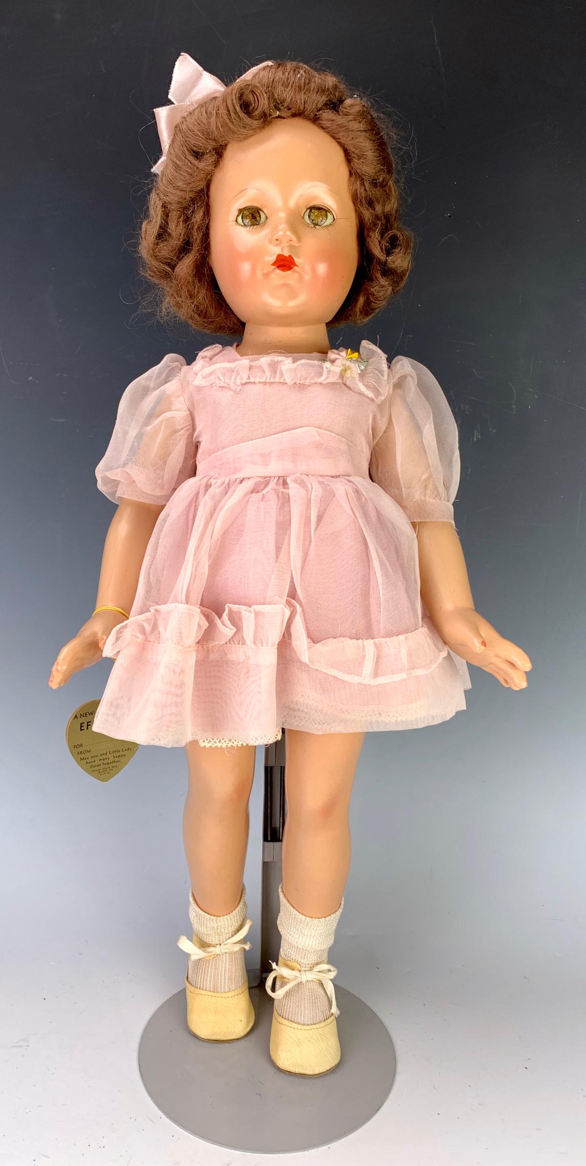 Effanbee Composition "Ann Shirley" Doll: Swivel head, 5 piece child body, original clothing, short pink dress, original manufacturers tag on arm "I am little lady", very good condition, 21" height *Private collection of a Los Angeles collect