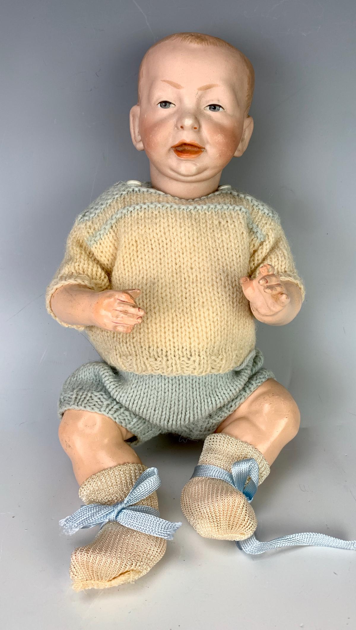 K*R Kaiser Baby Mold 100: Bisque head with blue painted eyes, solid dome, open close mouth, 5 piece composition baby body, has nose rub and minor surface scratches on cheeks, good condition, 11" height *Private collection of a