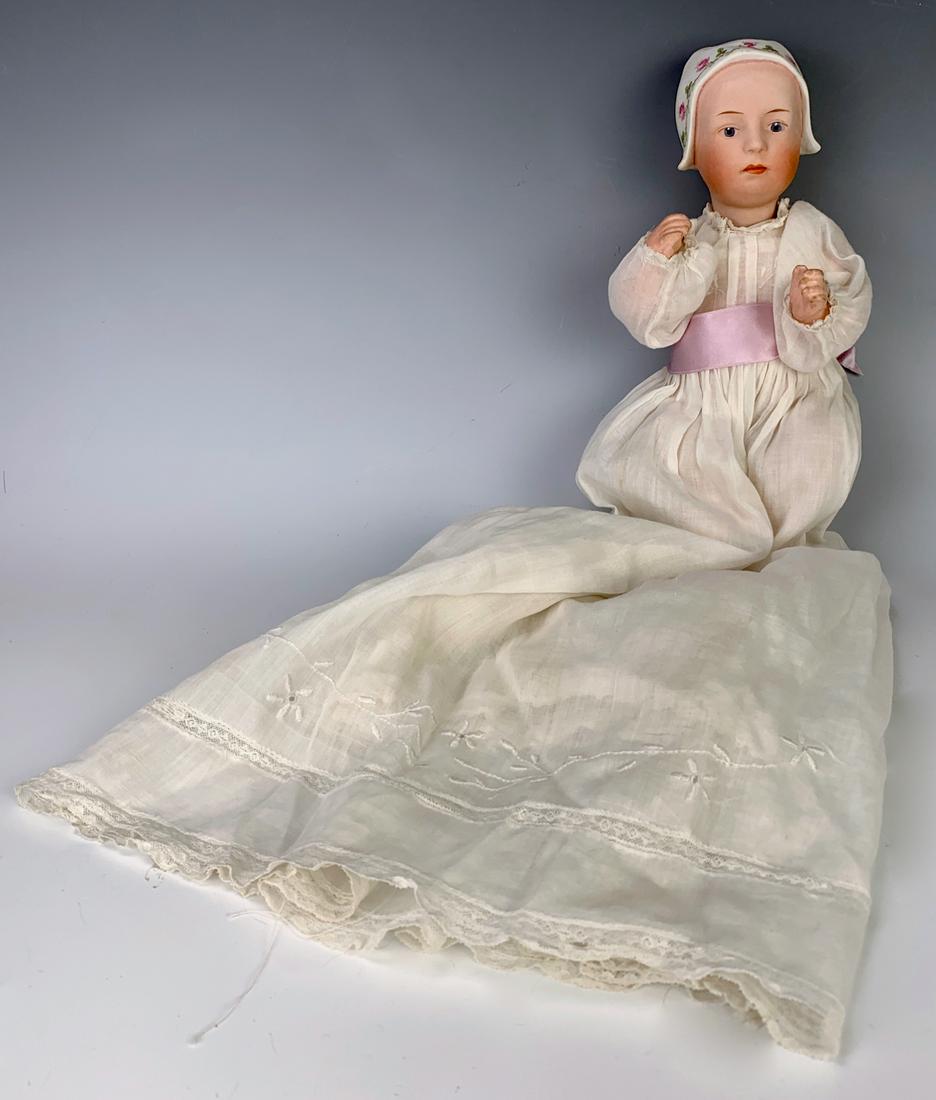 G. Heubach "Stuart" Baby Doll: Bisque head marked "7977", molded bonnet, blue painted intaglio eyes, 5 piece composition baby body, generally excellent condition, 10" height *Private collection of a Los Angeles collector.