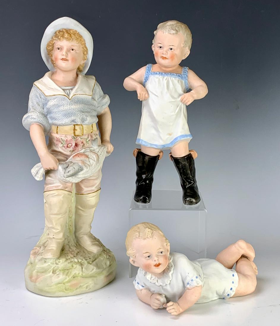 3 Attributed to G. Heubach Figurines Late 19th C.: Depicting a boy with black boots, boy with fish and a baby with snow ball, all made in Germany, very good condition, 14.25" tallest *Private collection of a Los Angeles collector.