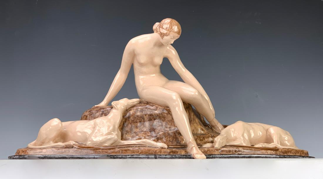 Ary Bitter (1883-1973) "Nude with Dogs" Figurine: Circa 1920's, having a high glazed terra cotta art deco figurine of a nude sitting on rocks with her borzoi dogs at her sides, signed "Ary Bitter", also marked "Made in France", very good condition, 2