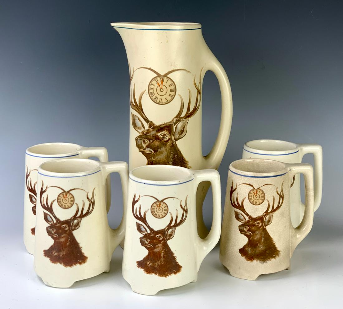 Roseville Creamware Pitcher & 5 Mugs "Elks": Roseville creamware pitcher and 5 mugs "Elks", good condition, 11.5" tallest