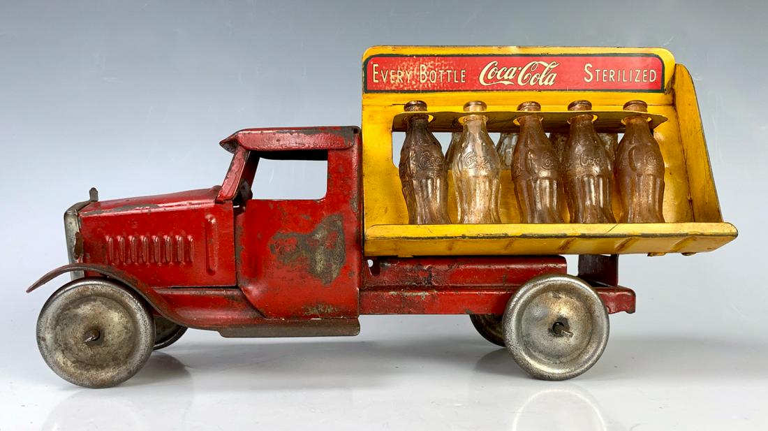 1930s Metalcraft Coca Cola Truck w/ Bottles: All original with original 10 glass bottles and original decals, original vintage nickel pressed steel wheels, wear to paint commensurate with age, 11" x 6"