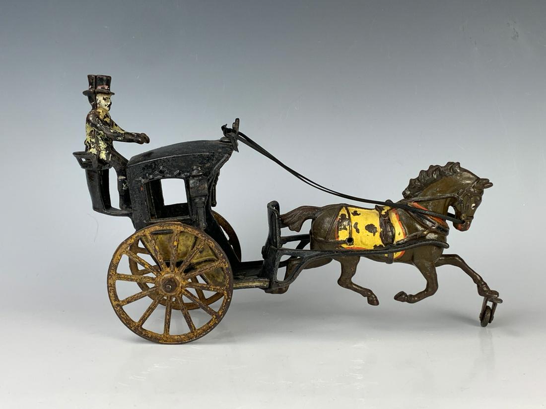 Rare Pratt & Letchworth Hansom Cab Cast Iron Toy: Great looking cast iron toy made in the late 1800's, single horse hansom cab, made by the famous toy maker Pratt & Letchworth, complete with original driver figure, wear to paint commensurate with age