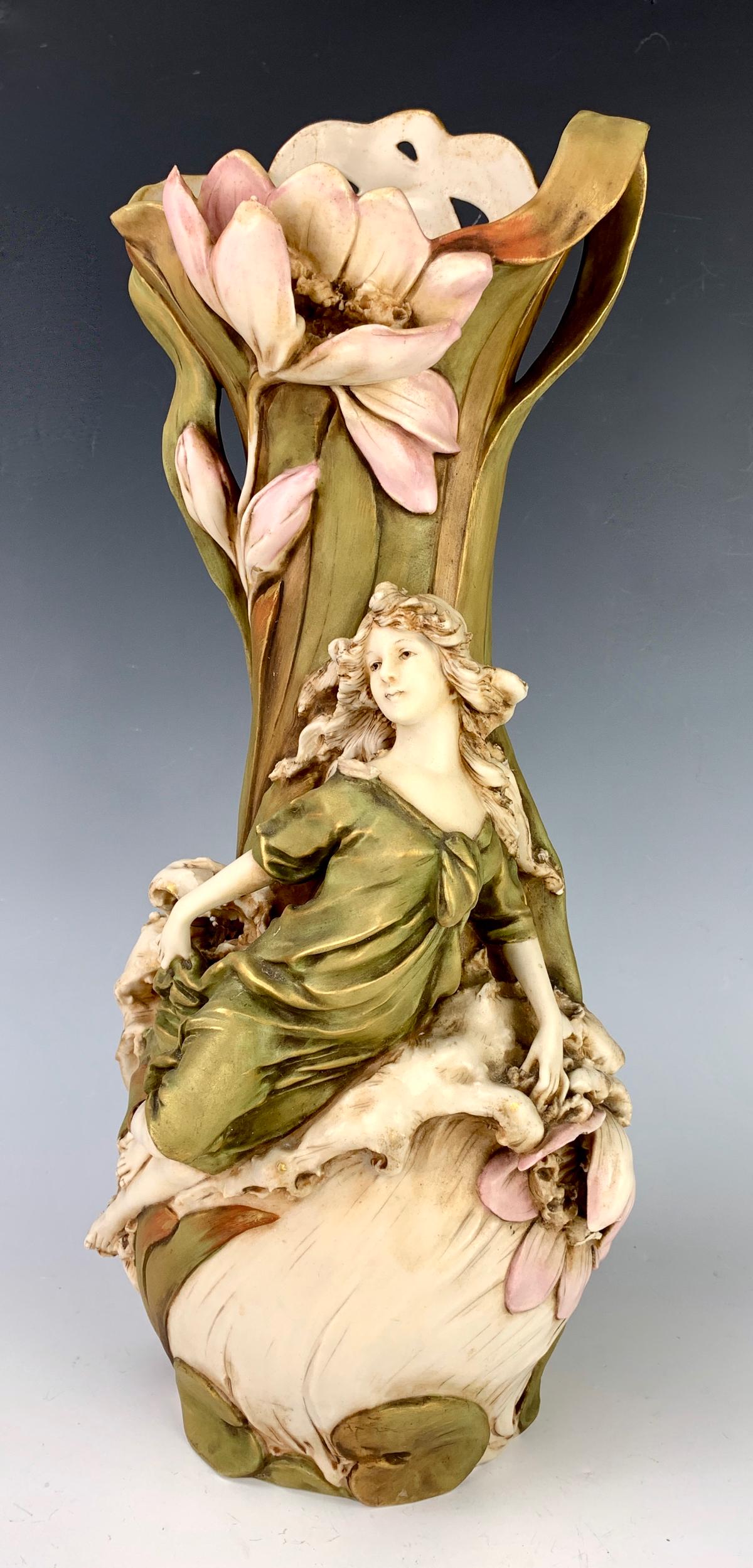 Royal Dux Art Nouveau Figural Vase C. 1900: Depicting a beauty in relief against a group of waves, flowers and leaves, signed with the Royal Dux pink triangle, very good condition, hole drilled for lamp conversion, 16.5" height