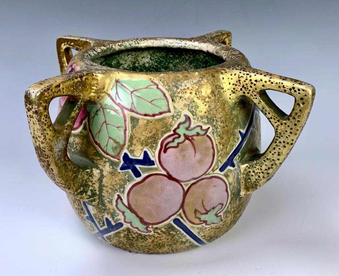 Large Amphora 4 Handled Vase with Flowers: Having a large porcelain Amphora 4 handled vase decorated with gilt body and hand painted flowers and fruit, marked with Amphora factory marks, very good condition, 7.5" x 12"